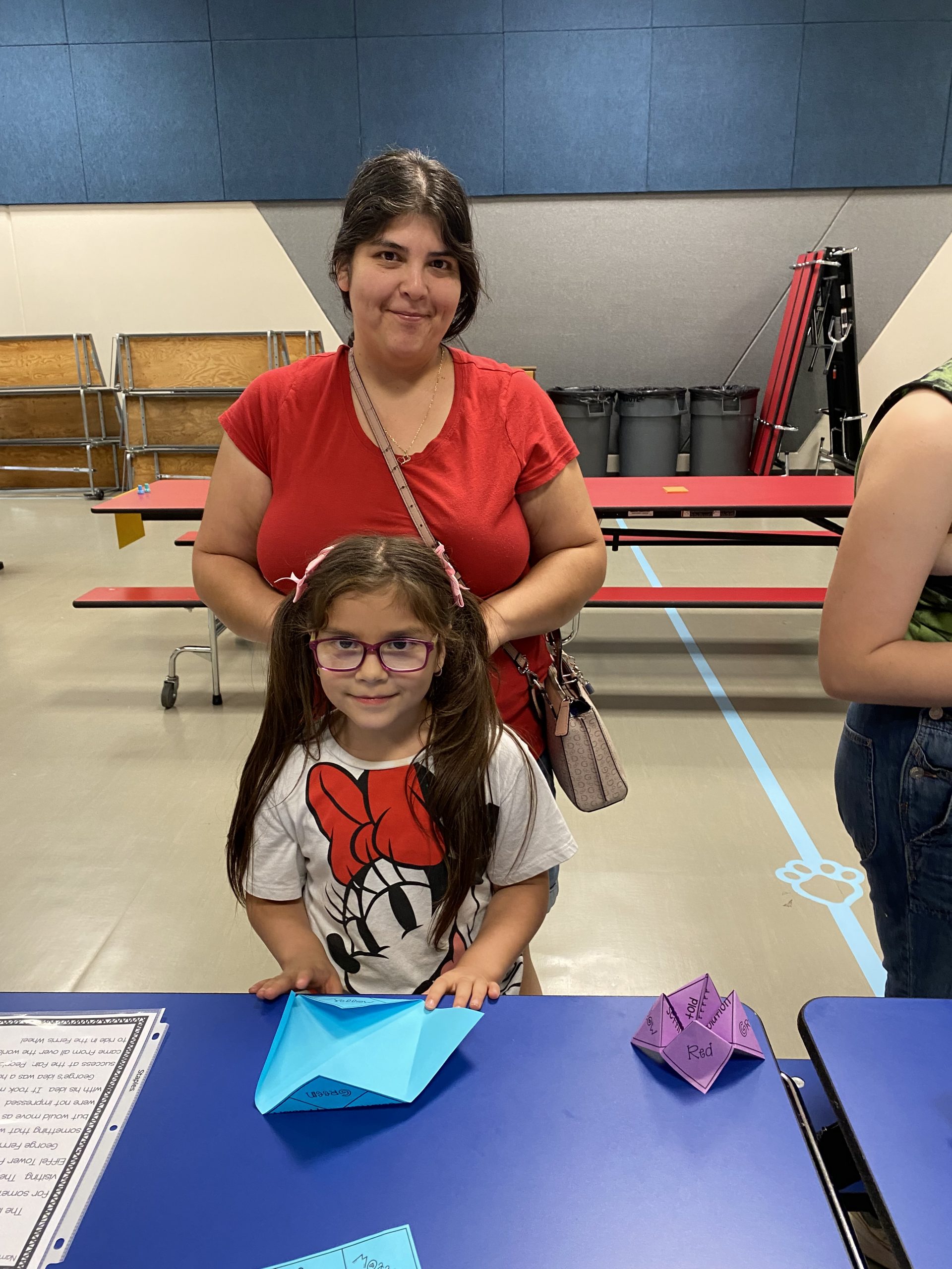 A mom and student working at a table during Literacy Night