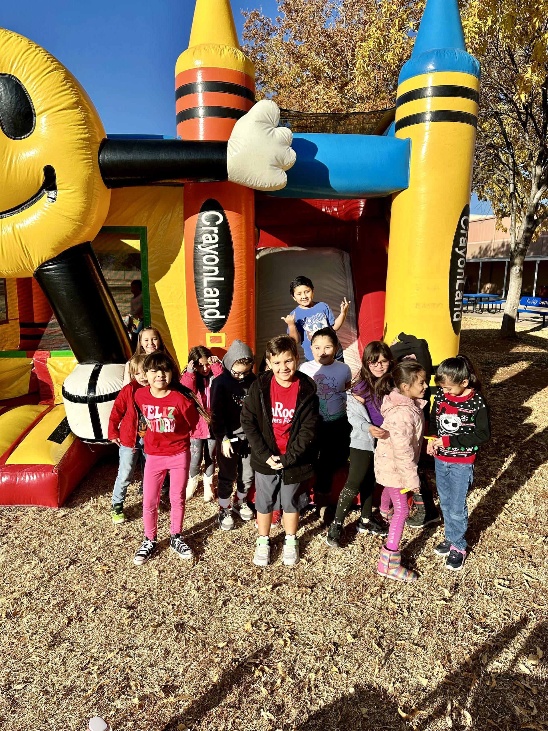 Student's from Mrs. Carreons class in front of the Bounce House