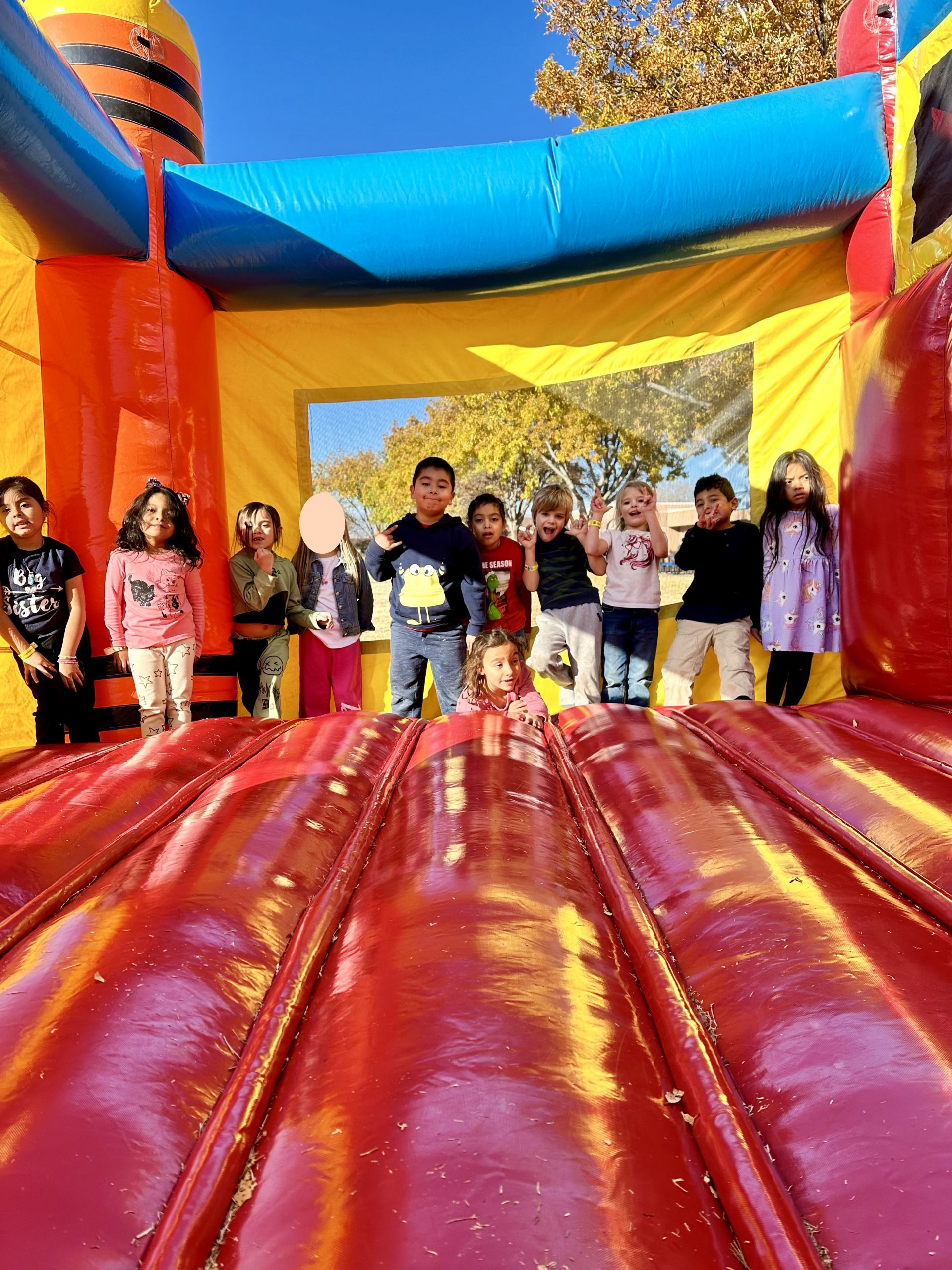 Student's from Mrs. Johnstone's class enjoying the Bounce House
