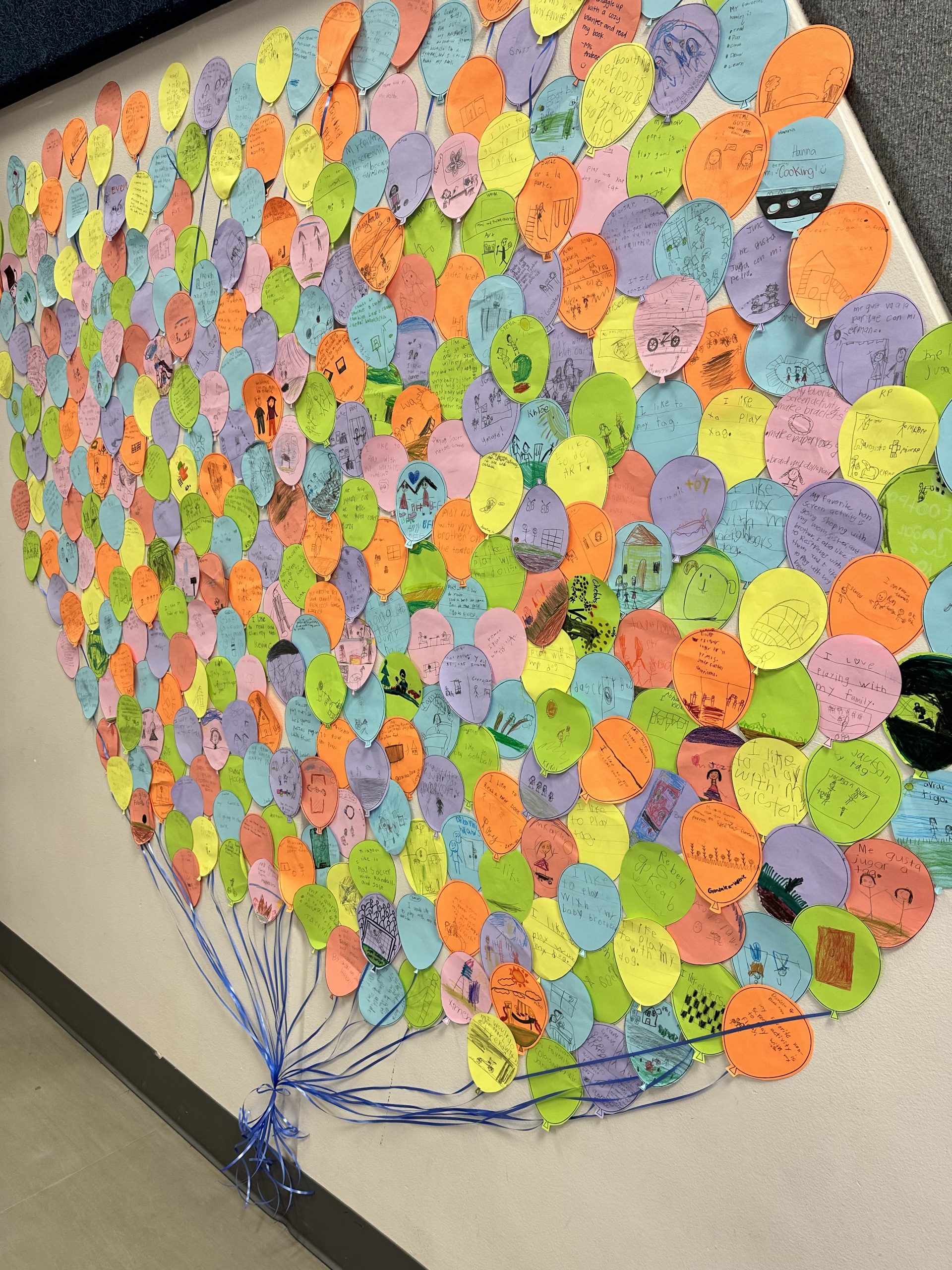 Many balloons shaped papers in different colors with student proclomations of what they like to do when they are not on electronics.